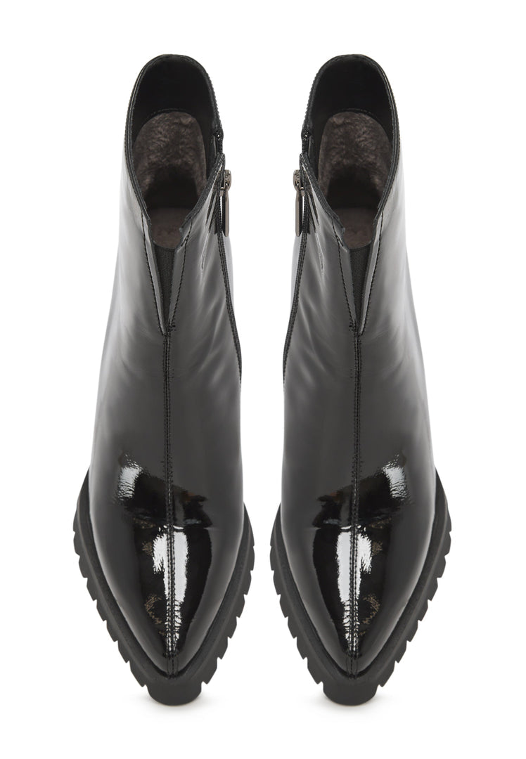 A stylish pair of black patent leather ankle boots, classic and versatile women's footwear.