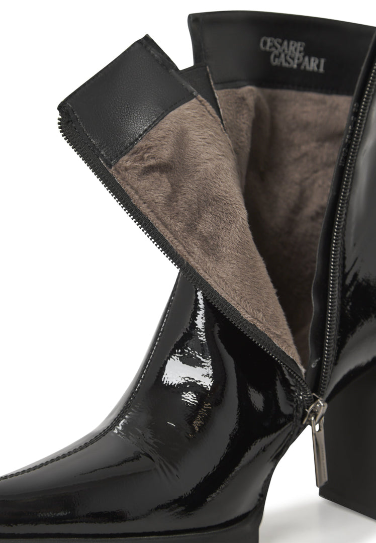 A stylish pair of women's black patent leather ankle boots, a classic addition to any footwear collection.