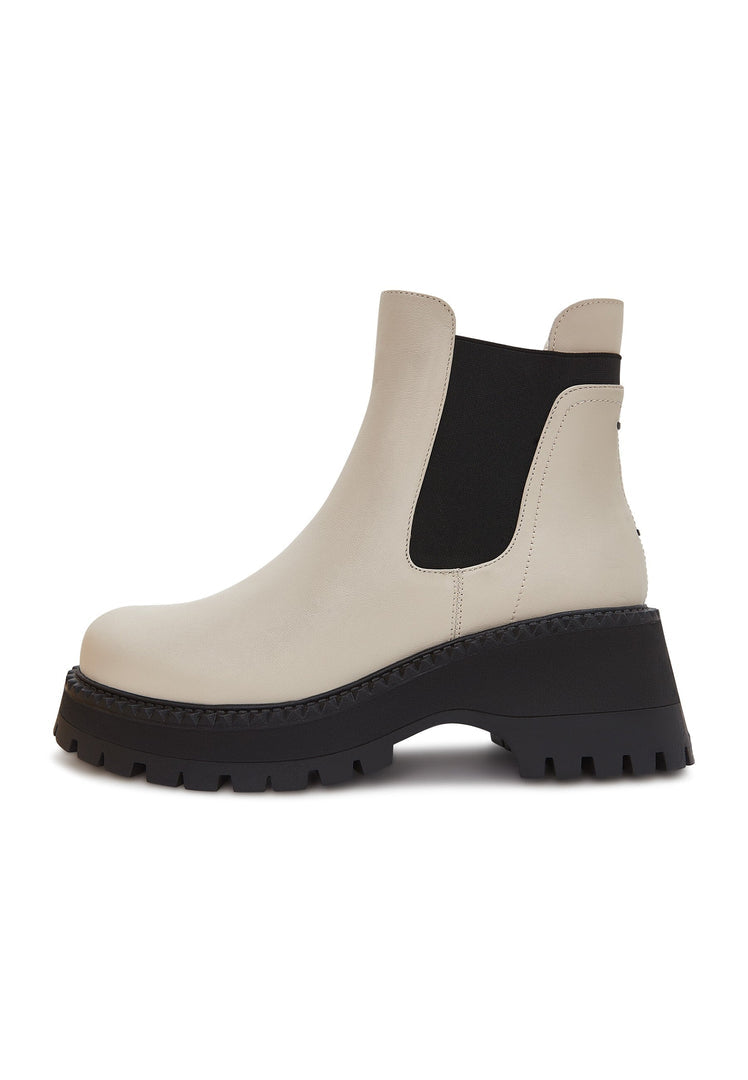 A stylish pair of beige chunky platform Chelsea boots for women, perfect for adding a touch of fashion flair to any outfit.