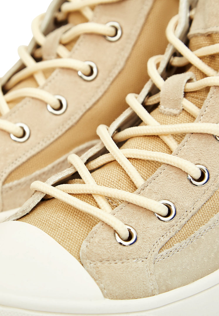 A stylish pair of lace-up high top sneakers with a unique textured design for a trendy look.