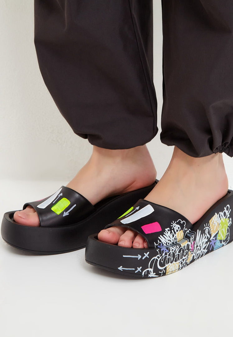 A stylish pair of black high heel mule shoes for women - a fashionable choice in women's footwear.