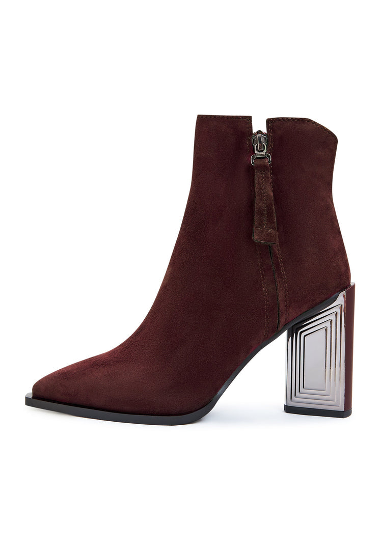A pair of stylish classic Bordeaux leather ankle boots for women, perfect for adding a touch of fashion-forward sophistication to any outfit.