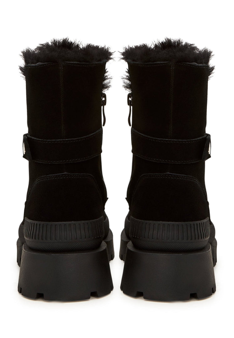 A pair of elegant black suede ankle boots, the perfect stylish and sophisticated footwear choice.