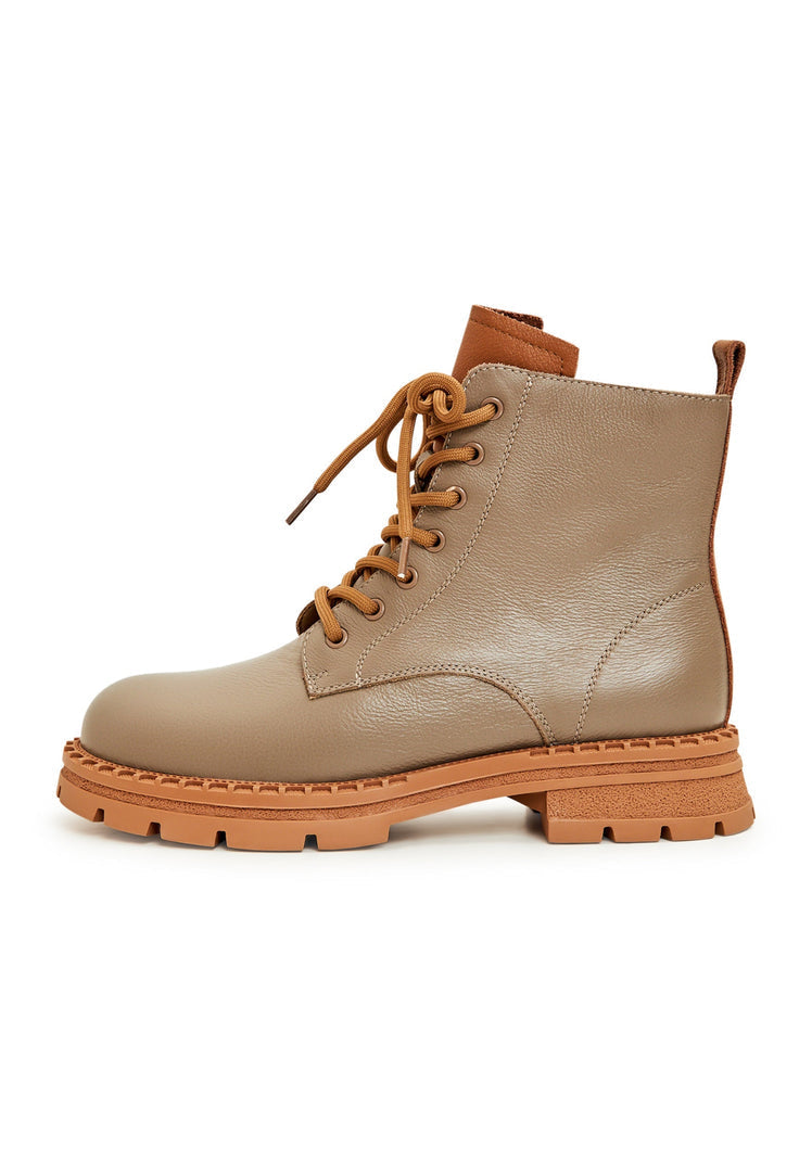 A stylish pair of women's beige leather lace-up ankle boots, perfect for the latest fashion trends.