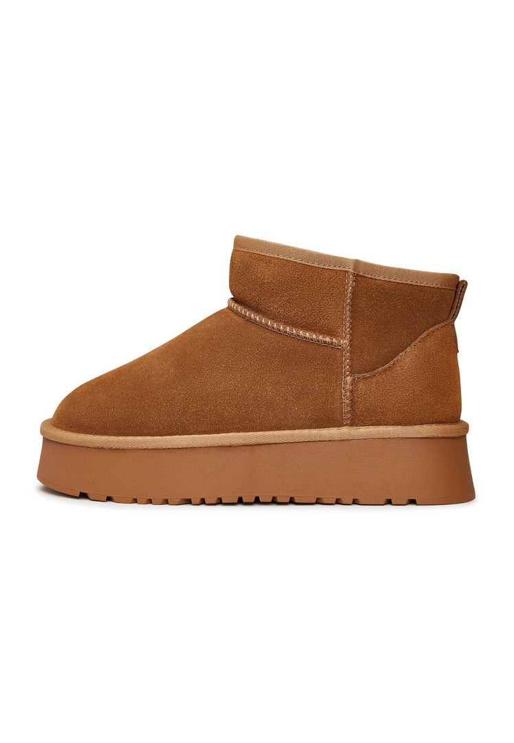 Stay stylish and cozy this winter with these trendy brown suede platform boots, perfect for completing your winter fashion look.