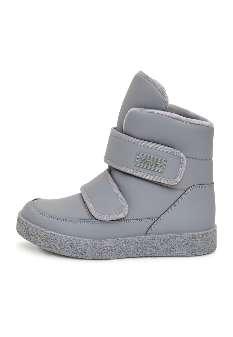 A pair of grey high-top winter boots with Velcro straps, ideal for cold weather and winter footwear.