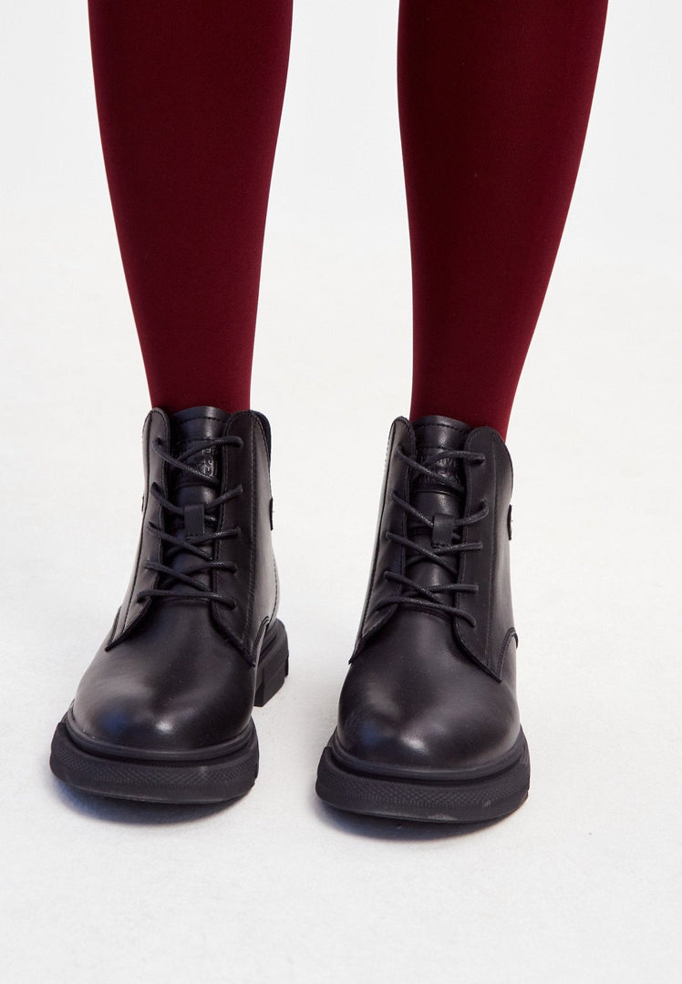 A stylish pair of black leather flat sole ankle boots for women with a chic design and comfortable flat heel.