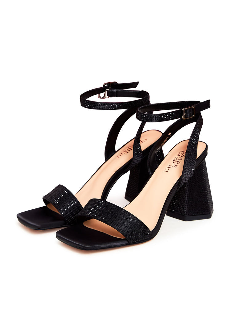 A stylish pair of black block heel strappy sandals with rhinestone detailing, perfect for women's footwear.