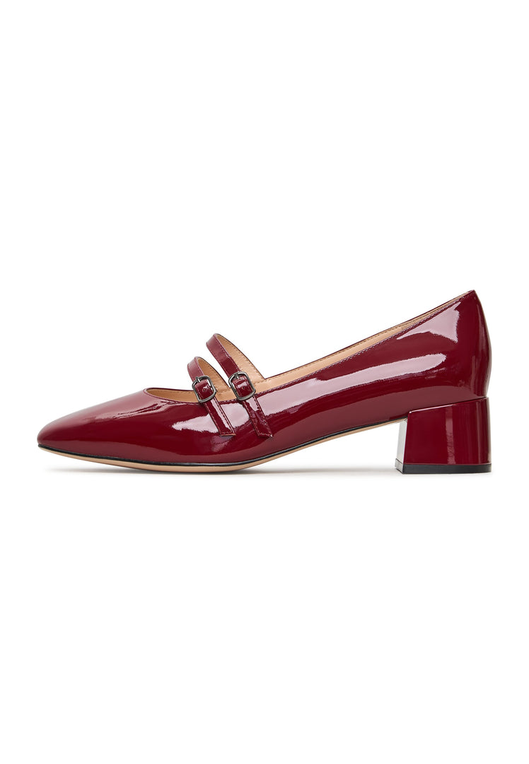 A pair of elegant red Mary Jane heels, perfect for women's formal events or special occasions.