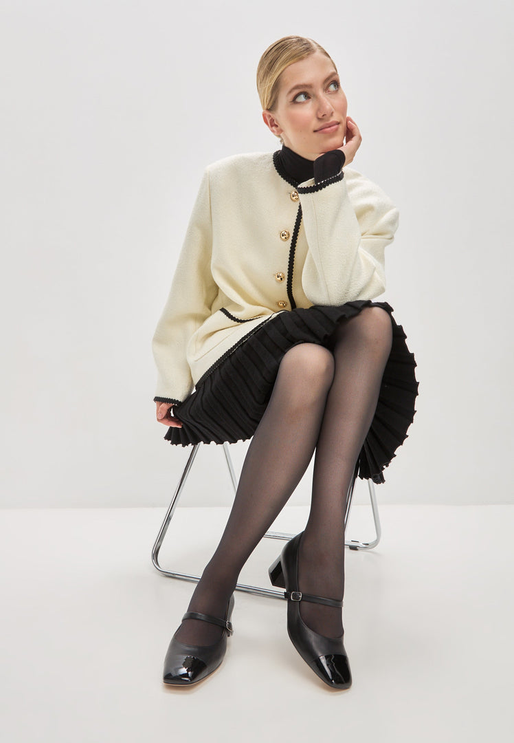 A stylish pair of black Mary Jane heels, the epitome of elegance and timeless fashion.