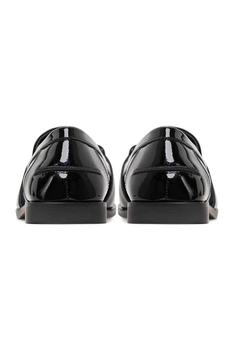 Black patent loafers with crystal embellishments, also known as Bagheera loafers, are stylish and elegant black embellished shoes.