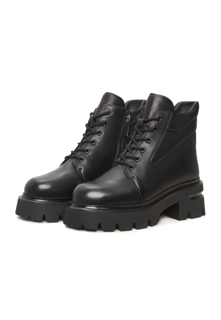 A trendy pair of black leather Freya platform ankle boots with chunky heels.