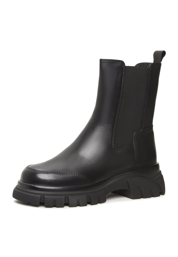 A close-up image of stylish black Göll ankle boots, featuring a bold design that is perfect for fashion-forward looks.