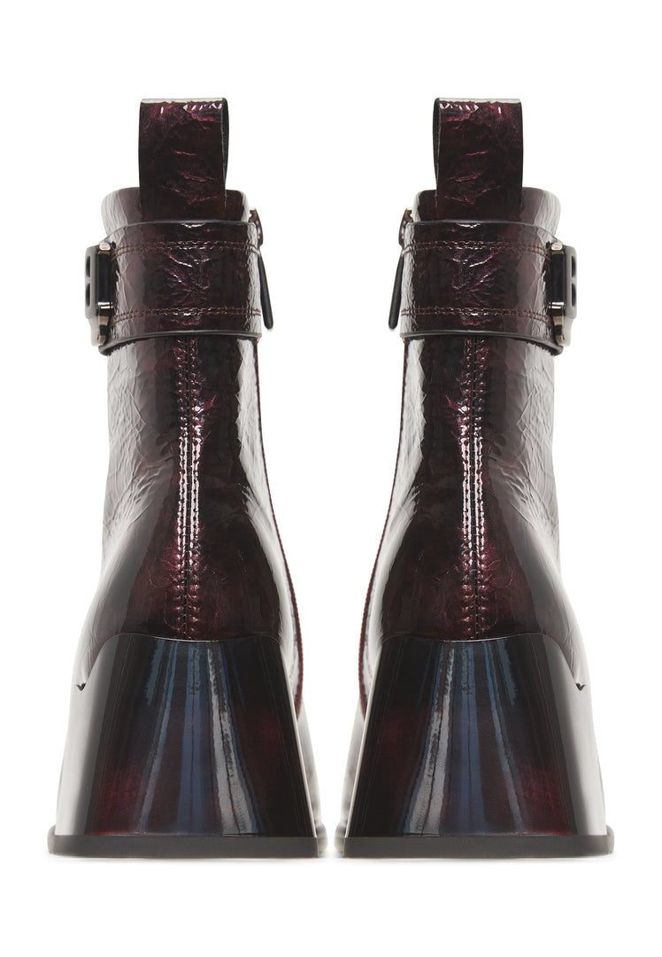 A pair of stylish women's Vika leather ankle boots in a rich Bordeaux color, creating sleek and sophisticated footwear.