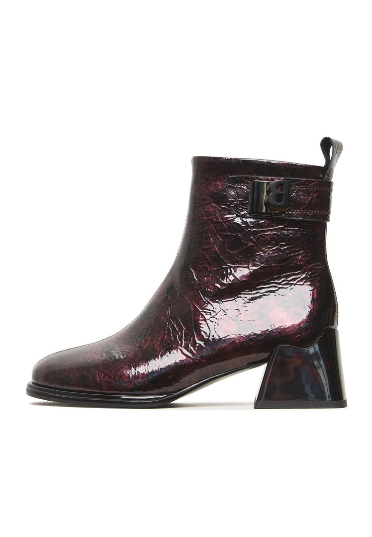 A pair of women's sleek leather ankle boots in Bordeaux color, known as the Vika boots