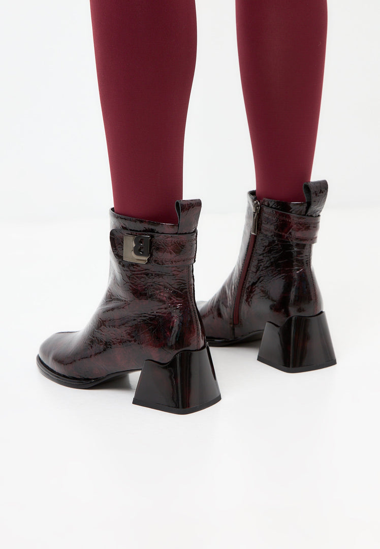 A pair of elegant women's Vika leather ankle boots in a stylish Bordeaux color, perfect for a sleek and sophisticated look.
