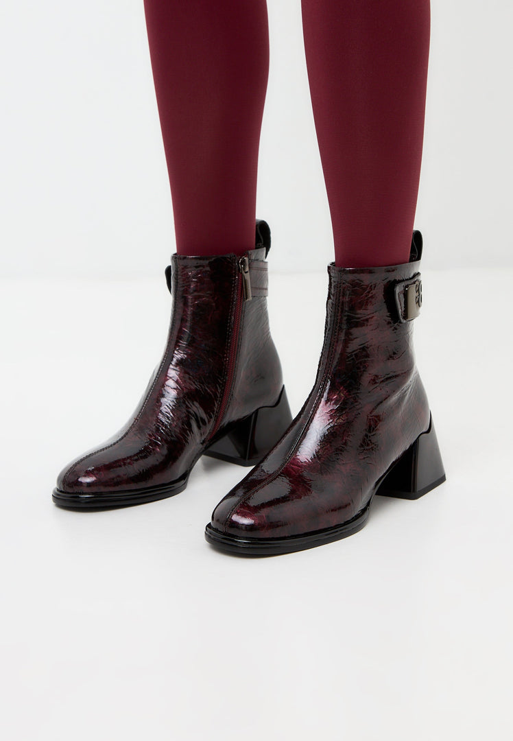 A stylish pair of Vika leather ankle boots in a beautiful Bordeaux color for women, showcasing sleek design.