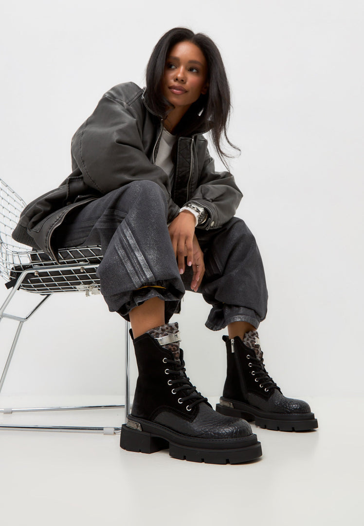 A stylish image of Luna ankle boots in black suede, featuring a platform heel design - perfect for a classic and trendy look.