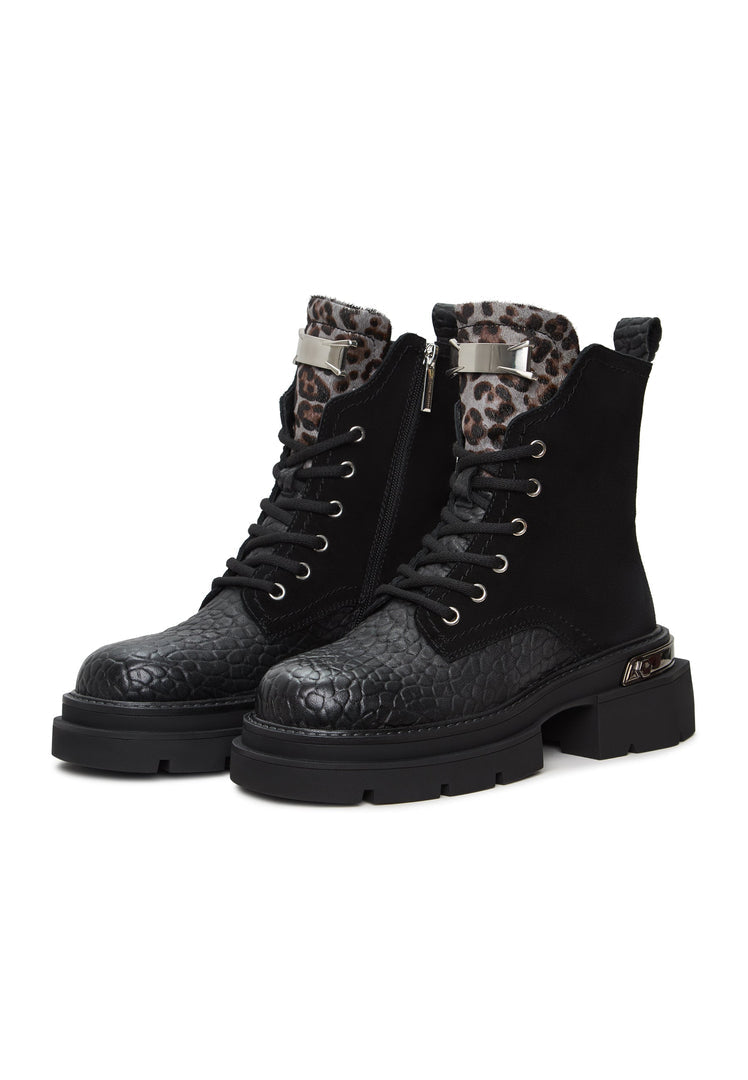 A pair of stylish Luna ankle boots in black suede with platform heels, perfect for adding a touch of elegance to any outfit.