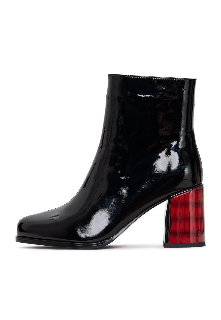 A stylish pair of women's black leather ankle boots, featuring a soft leather heel design with a patent finish known as the Ella heel boots.