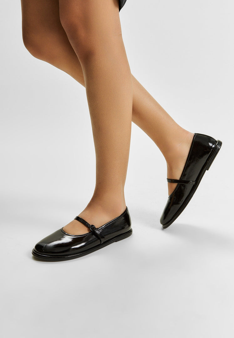 A stylish pair of black patent leather ballerinas - the Alba ballerinas, perfect for women looking for comfortable and elegant leather flats.
