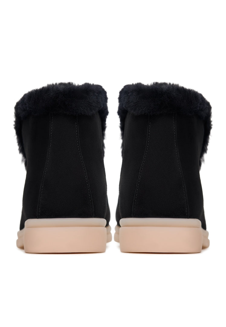 A stylish pair of women's winter ankle boots in black, known as the Antonia boots, perfect for the cold season.