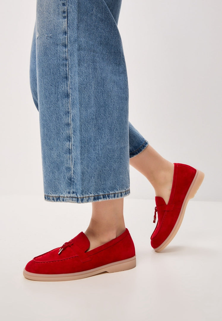 Stylish red platform moccasins, also known as Aurelia moccasins, are trendy red moccasin shoes with a platform sole, perfect for a fashionable look.