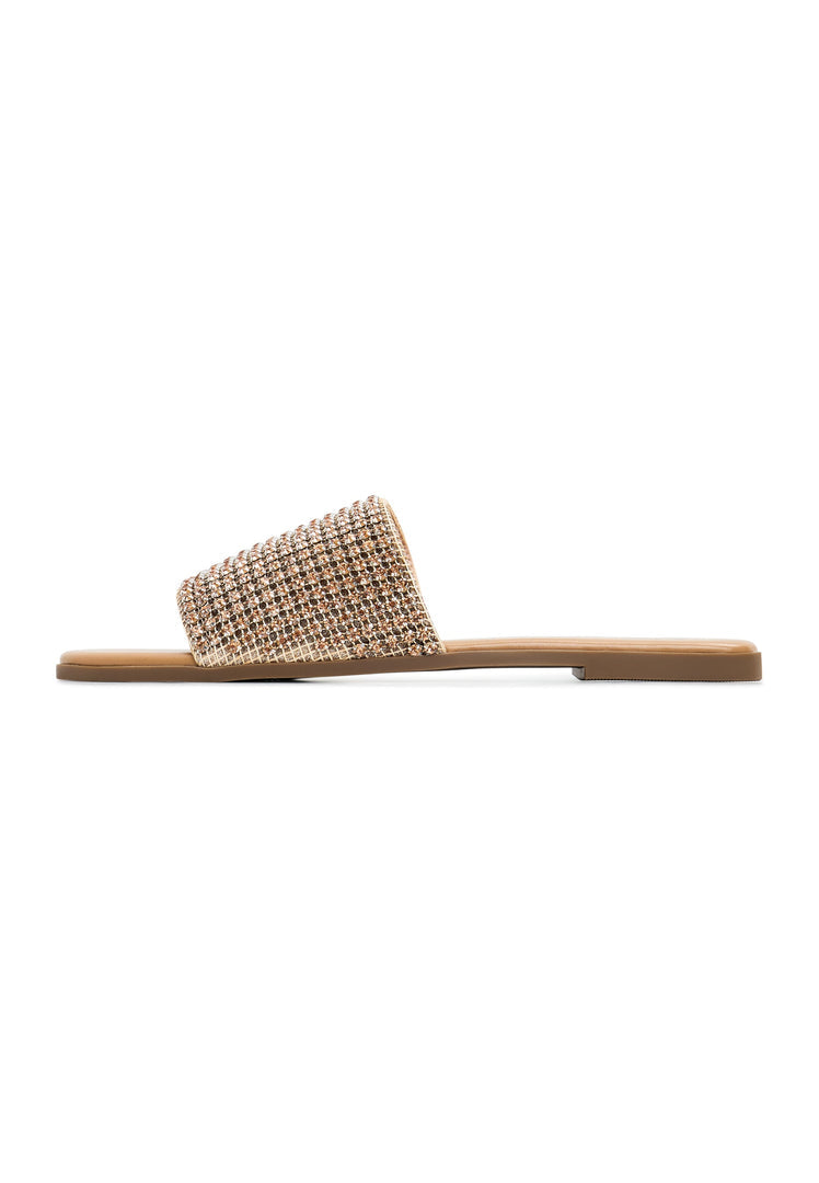 A pair of gold Izzy flat sole women's slippers, stylish and comfortable for everyday wear.