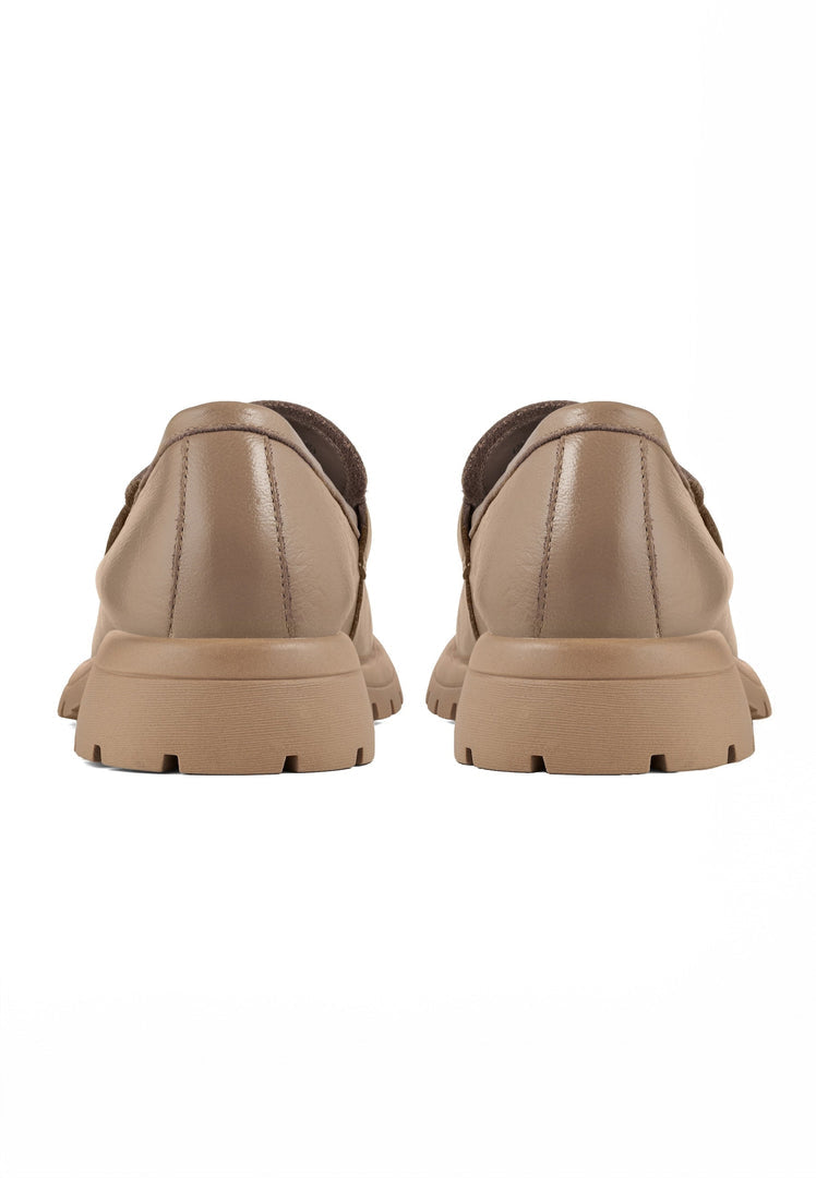 A stylish pair of women's beige leather platform loafers, perfect for adding a touch of sophistication to any outfit.