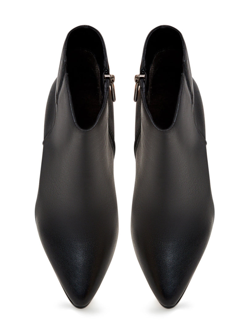 A trendy pair of fashionable black leather heeled boots with elevated heels, perfect for the fashion-forward individual.