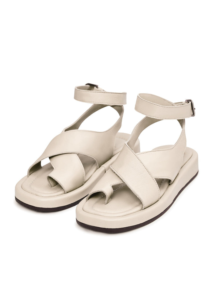 A pair of stylish beige leather platform sandals for women, perfect for summer footwear with high heels.