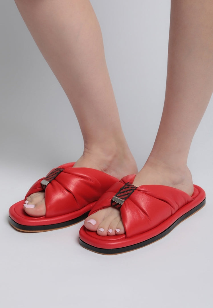 A pair of stylish red open toe flat sole women's sandals, perfect for summer footwear.