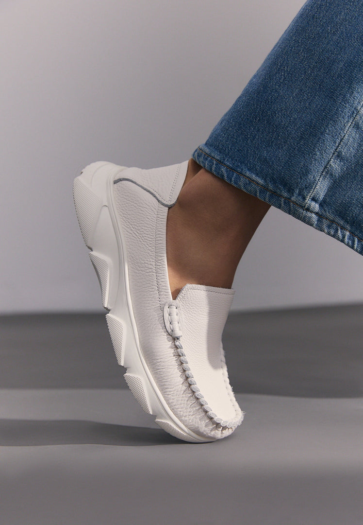 A stylish pair of white Alisa leather platform moccasins for women.