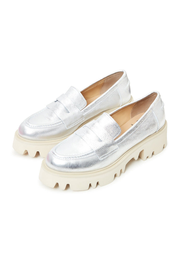 A pair of chunky silver platform loafers, perfect for fashionable women looking to make a statement with their footwear.