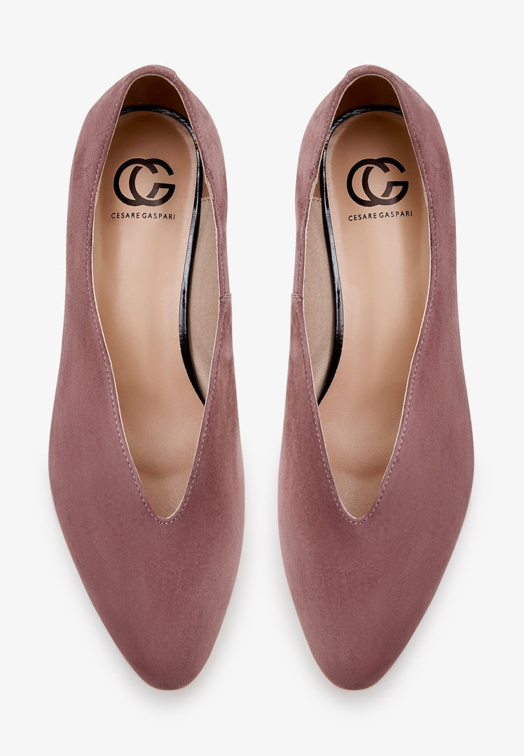 A stylish pair of women's pointed tip suede ballerinas in charming pink, perfect for fashion-forward women looking for chic and comfortable fashion flats.