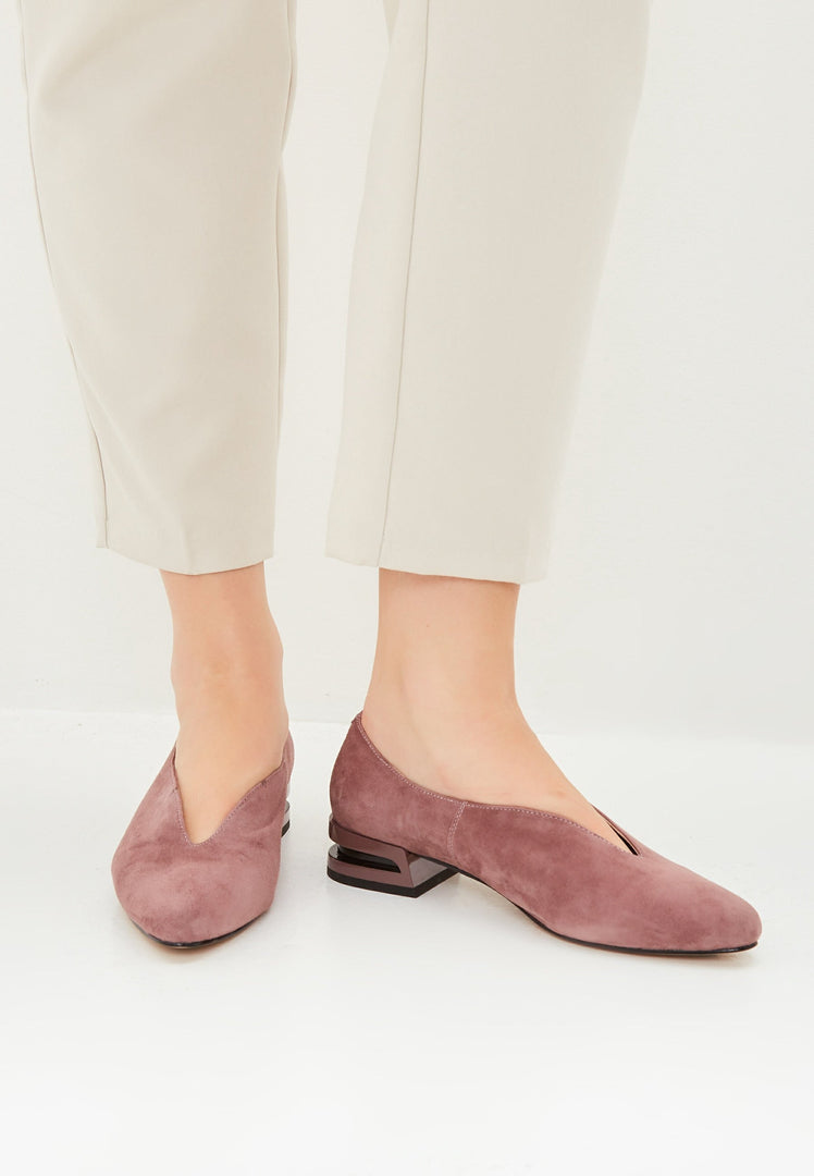 A pair of stylish pointed tip suede ballerinas in a pretty pink color, perfect for women's footwear fashion flats.