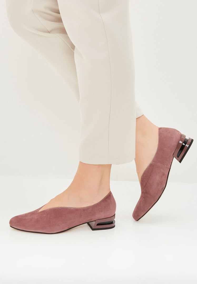 A stylish pair of pointed tip suede ballerinas in pink, perfect for women's footwear fashion flats.