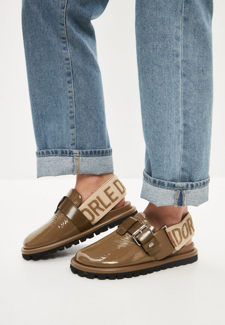 A stylish pair of women's khaki platform slingback Renata slippers.