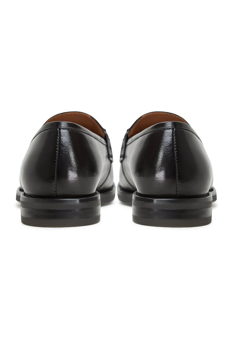 A stylish pair of black leather platform Olya loafers - the perfect blend of comfort and fashion for any outfit.