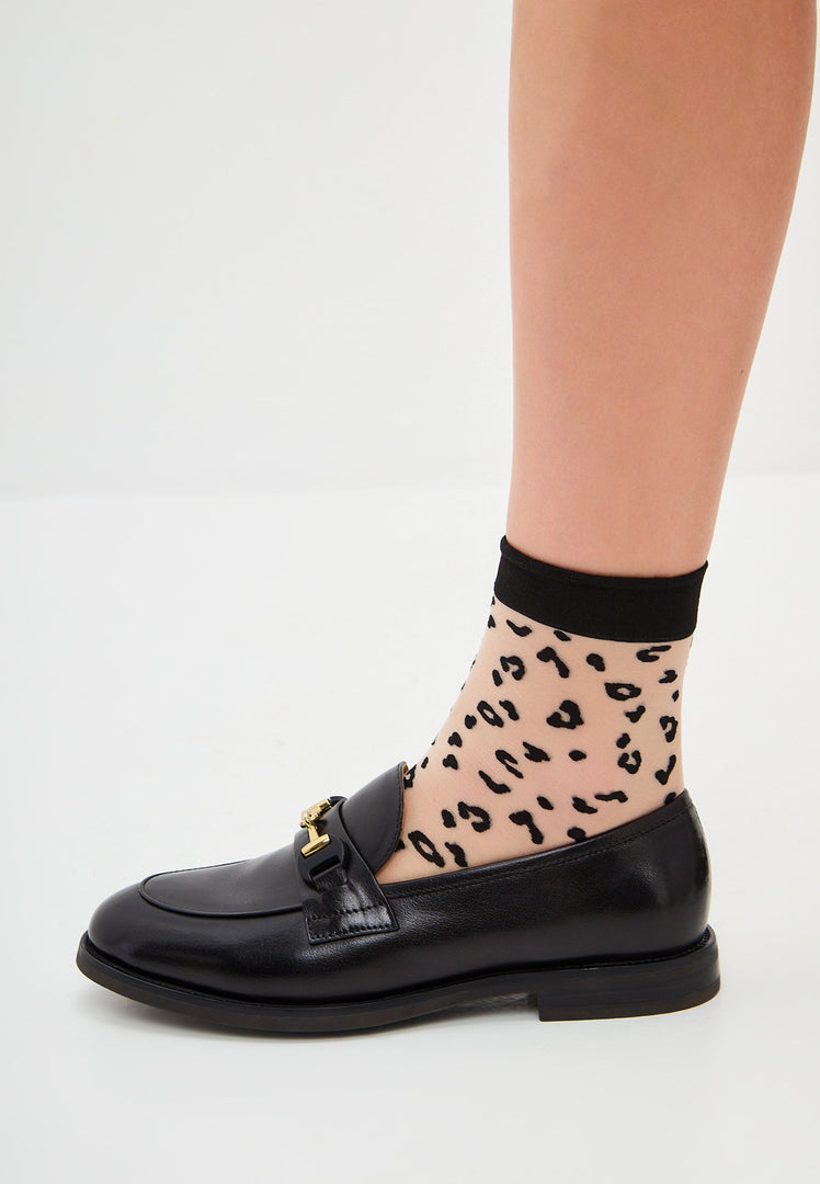 A stylish pair of leather platform loafers, also known as Olya loafers, perfect for adding a chic touch to any outfit.