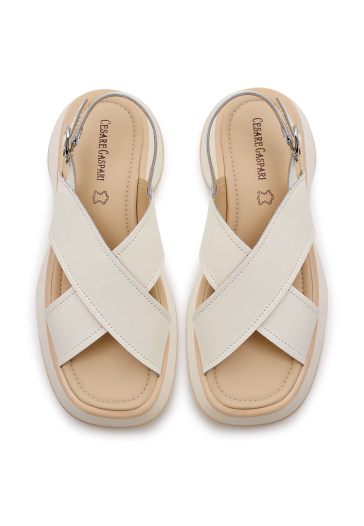 A stylish pair of white leather platform sandals for women, featuring the Tuti platform design.