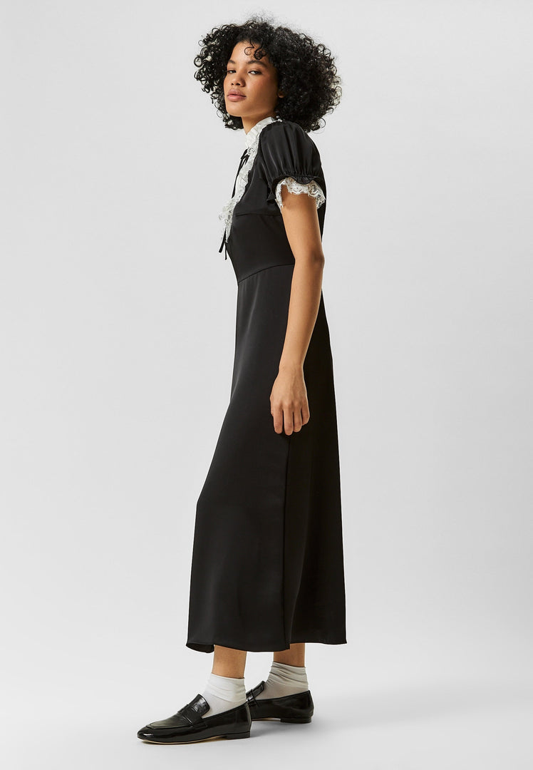 A stylish pair of black Diana block heeled loafers for women - perfect for your fall fashion shoe collection.