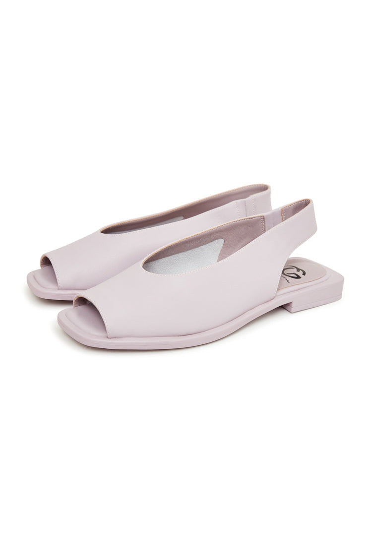 A pair of stylish flat sole violet women's sandals, perfect for summer and beach wear.