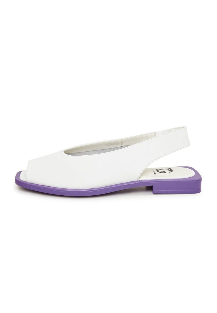 A pair of white flat sole women's sandals, perfect for summer and casual wear.