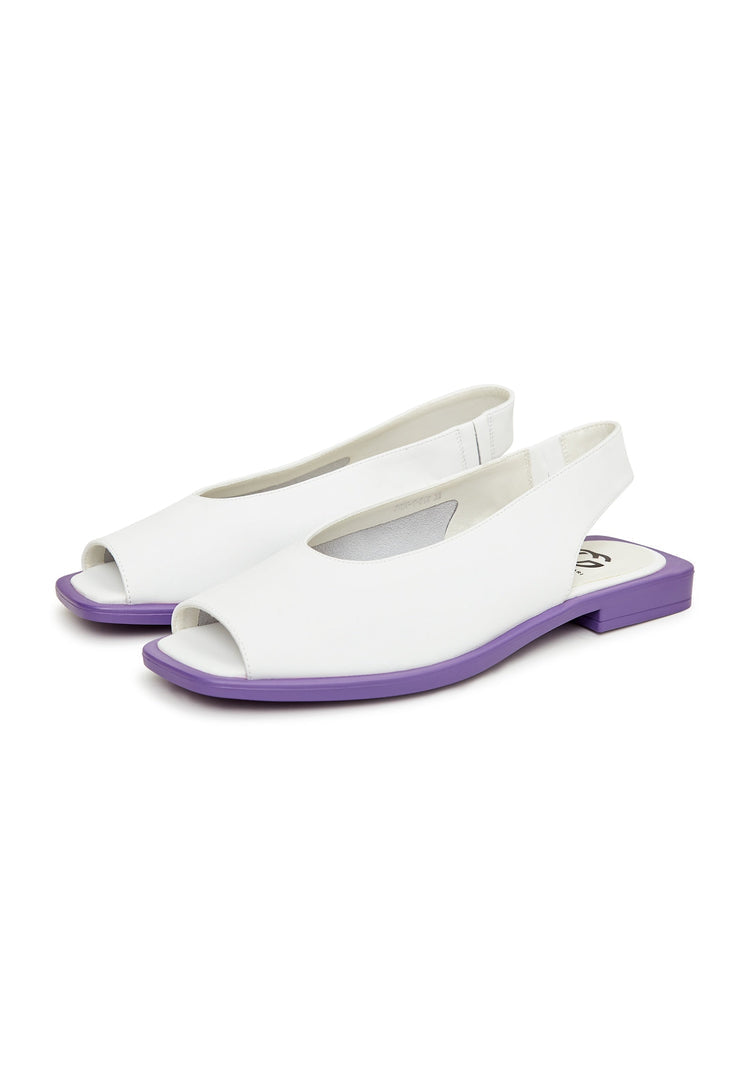 A pair of chic white flat sole women's sandals, perfect for your summer footwear collection. These casual sandals are a must-have for warm weather outings.