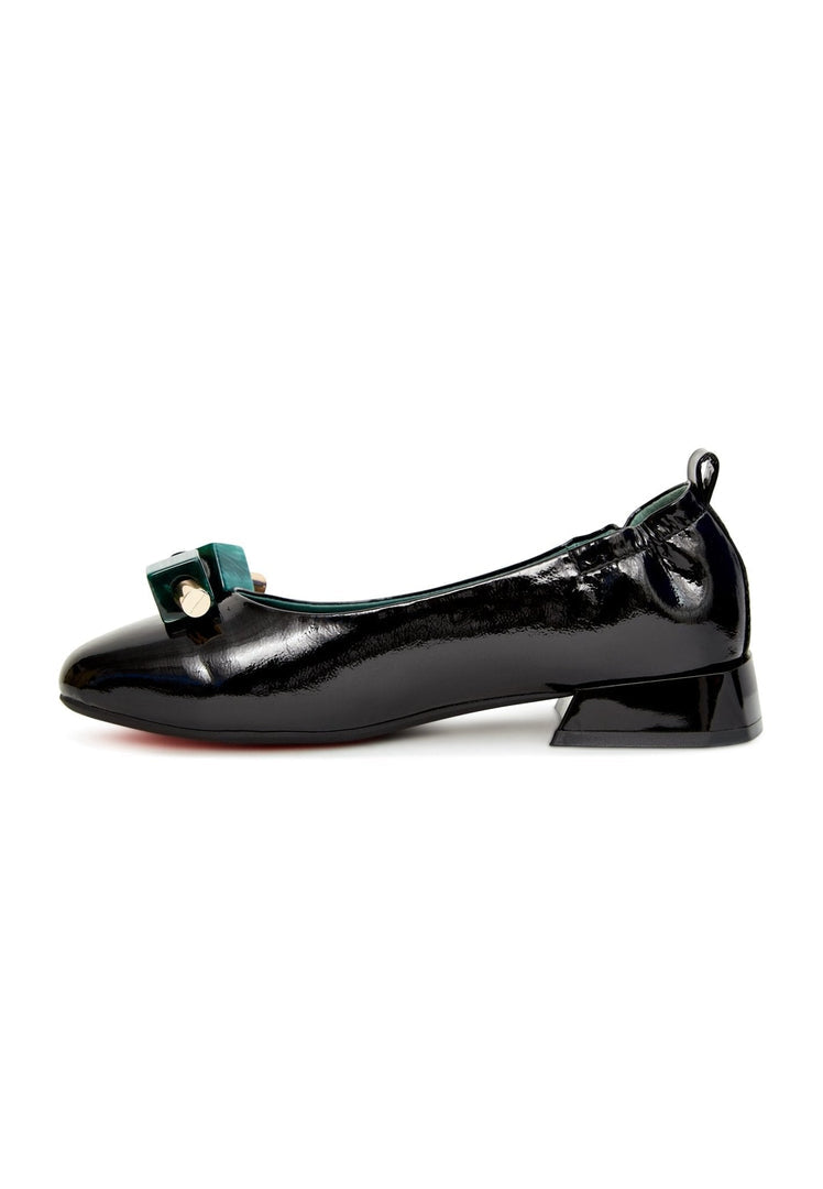 A stylish pair of women's patent leather ballet flats in black, featuring intricate embellishments.