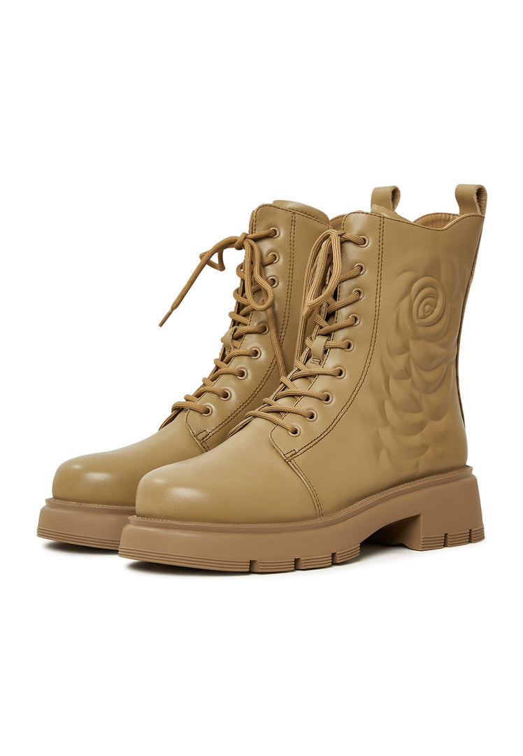A stylish pair of green leather platform ankle boots for a fashion-forward look.