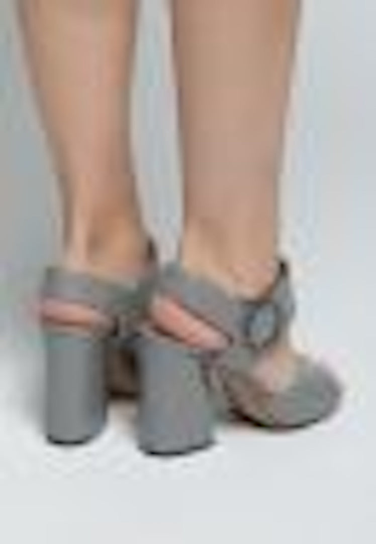 A trendy pair of women's block heel sandals with chunky heels, featuring a stylish design perfect for fashionistas and those looking for high heel sandals.