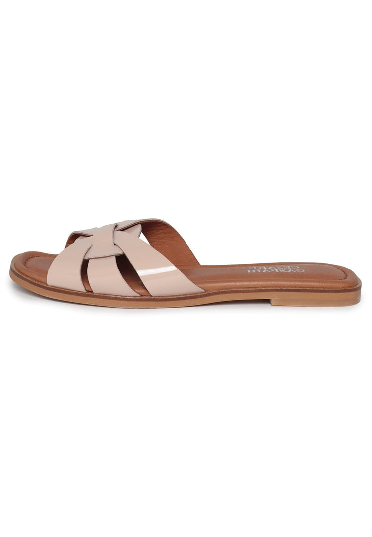 A pair of trendy beige slides with a gloss weave design, stylish summer shoes for a fashionable look.