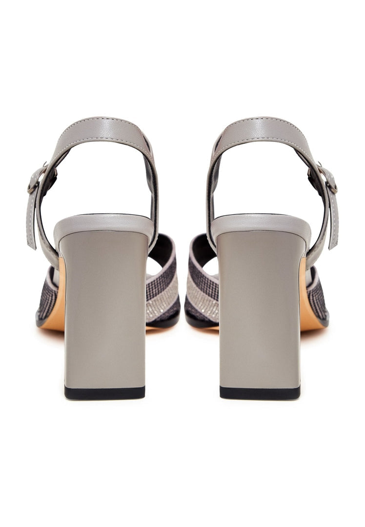 A pair of stunning silver elegance sandals for sale, showcasing elevated style and sophistication.